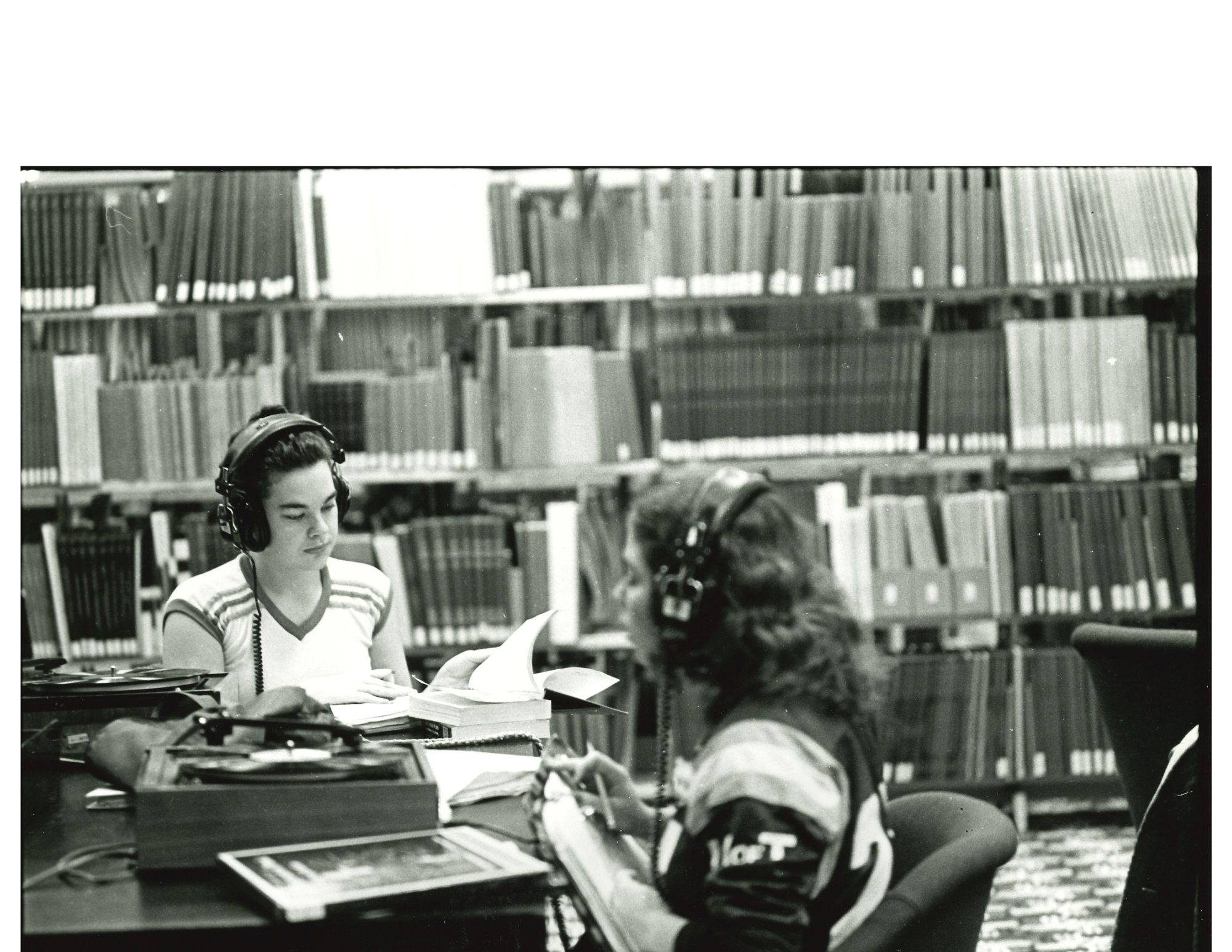 Listening to LP records at listening stations in 1985